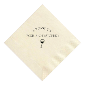 Raise your glasses with the A Toast To Wine Glass Napkin, featuring the phrase "A Toast to" arched gracefully above the couple's names, and a chic single line drawing of a wine glass below. Perfect for adding a bespoke touch to your wedding or rehearsal dinner.