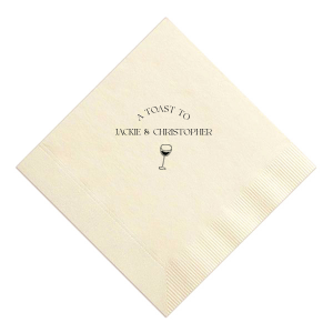 Raise your glasses with the A Toast To Wine Glass Napkin, featuring the phrase "A Toast to" arched gracefully above the couple's names, and a chic single line drawing of a wine glass below. Perfect for adding a bespoke touch to your wedding or rehearsal dinner.