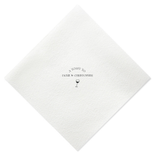 Raise your glasses with the A Toast To Wine Glass Napkin, featuring the phrase "A Toast to" arched gracefully above the couple's names, and a chic single line drawing of a wine glass below. Perfect for adding a bespoke touch to your wedding or rehearsal dinner.