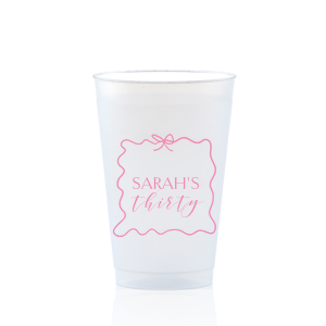 Sip in style at your birthday bash with the Ribbon Frame Birthday Bash Cup, elegantly framed like a ribbon and bow, featuring your name and new age in a whimsical script. A festive and personalized touch to celebrate another fabulous year.