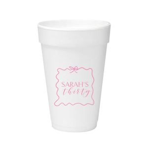 Sip in style at your birthday bash with the Ribbon Frame Birthday Bash Cup, elegantly framed like a ribbon and bow, featuring your name and new age in a whimsical script. A festive and personalized touch to celebrate another fabulous year.