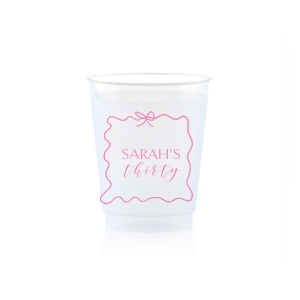 Sip in style at your birthday bash with the Ribbon Frame Birthday Bash Cup, elegantly framed like a ribbon and bow, featuring your name and new age in a whimsical script. A festive and personalized touch to celebrate another fabulous year.