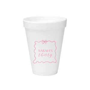 Sip in style at your birthday bash with the Ribbon Frame Birthday Bash Cup, elegantly framed like a ribbon and bow, featuring your name and new age in a whimsical script. A festive and personalized touch to celebrate another fabulous year.