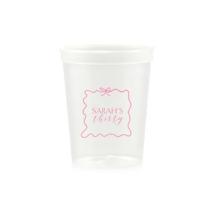 Sip in style at your birthday bash with the Ribbon Frame Birthday Bash Cup, elegantly framed like a ribbon and bow, featuring your name and new age in a whimsical script. A festive and personalized touch to celebrate another fabulous year.