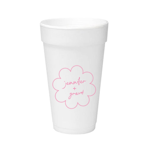 Sip in style at your whimsical wedding with the Kitschy Cocktail Hour Floral Frame Cup. Personalize this charming vessel with the couple's names, elegantly scripted within a blooming flower-shaped frame. A modern and enchanting choice for your celebratory toasts.