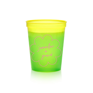 Sip in style at your whimsical wedding with the Kitschy Cocktail Hour Floral Frame Cup. Personalize this charming vessel with the couple's names, elegantly scripted within a blooming flower-shaped frame. A modern and enchanting choice for your celebratory toasts.