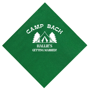 Gather around the campfire with the Camp Bachelorette Wilderness Napkin, personalized with "Camp Bach" arching over a charming tent and trees graphic, and the bachelorette's name prominently displayed below. A rustic yet chic touch to any outdoor bachelorette adventure.