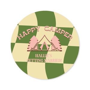 Tag your bachelorette party favors with the Camp Bachelorette Happy Camper Label, set against a trendy green and cream grid backdrop. The phrase "Happy Camper" arches over a quaint tent and tree illustration, with space below to personalize with the bachelorette's name. A picture-perfect finish to your outdoor-themed celebration.