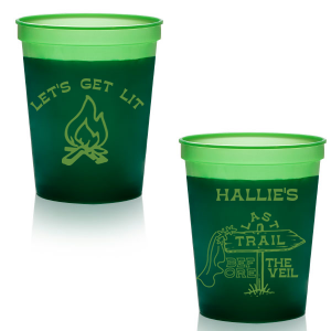 Gather around the bonfire with the Camp Bachelorette Last Trail Cup, featuring a lively campfire graphic paired with the cheeky phrase let's Get Lit, and a trailhead arrow dressed in a veil on the reverse, proclaiming "Last Trail Before the Veil." Customize with the bachelorette's name for a memento that captures the spirit of her final single days in the great outdoors.