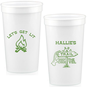 Gather around the bonfire with the Camp Bachelorette Last Trail Cup, featuring a lively campfire graphic paired with the cheeky phrase let's Get Lit, and a trailhead arrow dressed in a veil on the reverse, proclaiming "Last Trail Before the Veil." Customize with the bachelorette's name for a memento that captures the spirit of her final single days in the great outdoors.