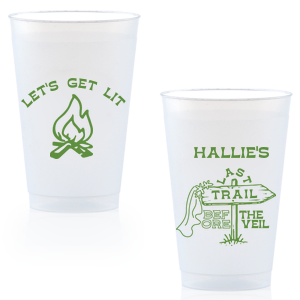 Gather around the bonfire with the Camp Bachelorette Last Trail Cup, featuring a lively campfire graphic paired with the cheeky phrase let's Get Lit, and a trailhead arrow dressed in a veil on the reverse, proclaiming "Last Trail Before the Veil." Customize with the bachelorette's name for a memento that captures the spirit of her final single days in the great outdoors.