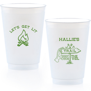 Gather around the bonfire with the Camp Bachelorette Last Trail Cup, featuring a lively campfire graphic paired with the cheeky phrase let's Get Lit, and a trailhead arrow dressed in a veil on the reverse, proclaiming "Last Trail Before the Veil." Customize with the bachelorette's name for a memento that captures the spirit of her final single days in the great outdoors.