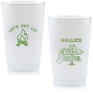 Gather around the bonfire with the Camp Bachelorette Last Trail Cup, featuring a lively campfire graphic paired with the cheeky phrase let's Get Lit, and a trailhead arrow dressed in a veil on the reverse, proclaiming "Last Trail Before the Veil." Customize with the bachelorette's name for a memento that captures the spirit of her final single days in the great outdoors.