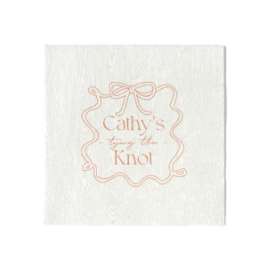 Celebrate the bride-to-be with the Ribbon Frame Tying the Knot Napkin, featuring her name elegantly placed above the phrase Tying the Knot in a contemporary script. Enclosed by a looping ribbon frame with a neat bow, this napkin adds a sophisticated and whimsical touch to her bridal shower.