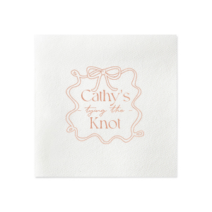 Celebrate the bride-to-be with the Ribbon Frame Tying the Knot Napkin, featuring her name elegantly placed above the phrase Tying the Knot in a contemporary script. Enclosed by a looping ribbon frame with a neat bow, this napkin adds a sophisticated and whimsical touch to her bridal shower.