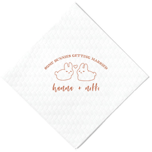 Hop into matrimonial joy with the Some Bunnies Wedding Napkin, complete with an adorable drawing of two bunnies and a heart nestled between them. The playful phrase "Some Bunnies Getting Married" sets a whimsical tone, while the area below awaits the couple's names, scripted with modern elegance. A delightful addition to your wedding tablescapes.