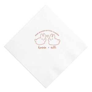 Hop into matrimonial joy with the Some Bunnies Wedding Napkin, complete with an adorable drawing of two bunnies and a heart nestled between them. The playful phrase "Some Bunnies Getting Married" sets a whimsical tone, while the area below awaits the couple's names, scripted with modern elegance. A delightful addition to your wedding tablescapes.