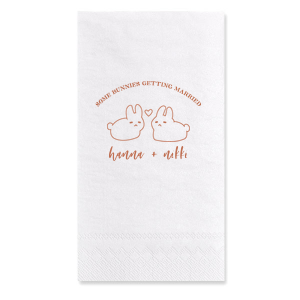 Hop into matrimonial joy with the Some Bunnies Wedding Napkin, complete with an adorable drawing of two bunnies and a heart nestled between them. The playful phrase "Some Bunnies Getting Married" sets a whimsical tone, while the area below awaits the couple's names, scripted with modern elegance. A delightful addition to your wedding tablescapes.