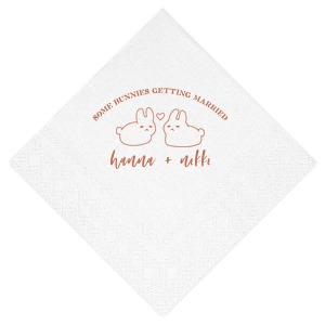 Hop into matrimonial joy with the Some Bunnies Wedding Napkin, complete with an adorable drawing of two bunnies and a heart nestled between them. The playful phrase "Some Bunnies Getting Married" sets a whimsical tone, while the area below awaits the couple's names, scripted with modern elegance. A delightful addition to your wedding tablescapes.