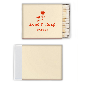 Ignite the spark of your wedding day with the Toasting Hands Wedding Matches, featuring an endearing illustration of a cartoon hand with a glass of wine raised in a celebratory toast. Below the image, the couple's names are elegantly written in a charming script, with the event date thoughtfully placed in a classic serif font. These matches are a delightful memento of your union.