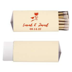 Ignite the spark of your wedding day with the Toasting Hands Wedding Matches, featuring an endearing illustration of a cartoon hand with a glass of wine raised in a celebratory toast. Below the image, the couple's names are elegantly written in a charming script, with the event date thoughtfully placed in a classic serif font. These matches are a delightful memento of your union.