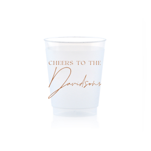 Raise a toast with the Boho Terracotta Cheers to the Wedding Cup, where rustic meets refinement. The phrase "Cheers to the" is beautifully presented in a classic serif font, inviting you to inscribe the couple's surname below in a sophisticated script. A cup that embodies the warmth and subtle drama of your autumnal nuptials.