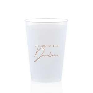 Raise a toast with the Boho Terracotta Cheers to the Wedding Cup, where rustic meets refinement. The phrase "Cheers to the" is beautifully presented in a classic serif font, inviting you to inscribe the couple's surname below in a sophisticated script. A cup that embodies the warmth and subtle drama of your autumnal nuptials.