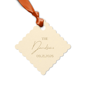 Add a personalized touch to your wedding favors with the Boho Terracotta Wedding Date Gift Tag. This tag begins with "The" in a stately serif font, followed by the newlyweds' surname in a graceful script. Finalize this bespoke detail with the date of your special day, all in the same classic font, capturing the essence of your chic and moody fall celebration.