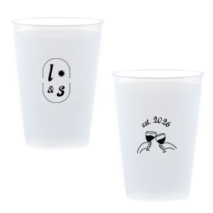 The Sunburst Initial & Toasting Glass Cup features an oval frame with classic initials, a subtle star accent, and a toast illustration with the date on the reverse. Order yours to serve drinks with a chic, custom feel guests will love. Fitting for weddings and engagement parties!