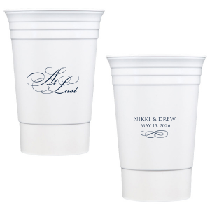 The At Last Cup features elegant calligraphy reading “At Last” reversed with the couple's names and a graceful flourish for a timeless drinkware detail. Use it to elevate your celebration with a romantic touch. Refined for wedding receptions and sentimental keepsakes.