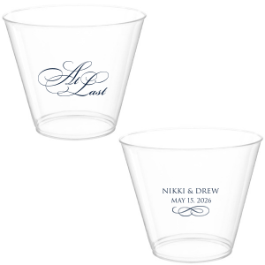 The At Last Cup features elegant calligraphy reading “At Last” reversed with the couple's names and a graceful flourish for a timeless drinkware detail. Use it to elevate your celebration with a romantic touch. Refined for wedding receptions and sentimental keepsakes.