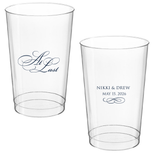 The At Last Cup features elegant calligraphy reading “At Last” reversed with the couple's names and a graceful flourish for a timeless drinkware detail. Use it to elevate your celebration with a romantic touch. Refined for wedding receptions and sentimental keepsakes.