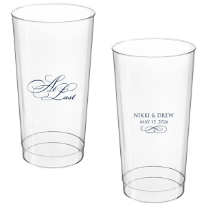 The At Last Cup features elegant calligraphy reading “At Last” reversed with the couple's names and a graceful flourish for a timeless drinkware detail. Use it to elevate your celebration with a romantic touch. Refined for wedding receptions and sentimental keepsakes.