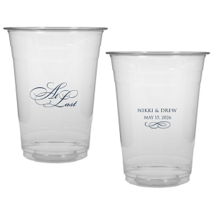 The At Last Cup features elegant calligraphy reading “At Last” reversed with the couple's names and a graceful flourish for a timeless drinkware detail. Use it to elevate your celebration with a romantic touch. Refined for wedding receptions and sentimental keepsakes.