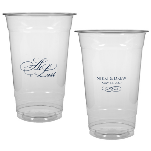 The At Last Cup features elegant calligraphy reading “At Last” reversed with the couple's names and a graceful flourish for a timeless drinkware detail. Use it to elevate your celebration with a romantic touch. Refined for wedding receptions and sentimental keepsakes.