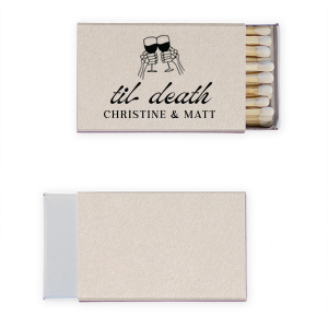 Find the perfect match with the Til Death Toast Match. Heat things up at your event with this striking accessory. Adorned with two skeletal hands clinking wine glasses above personalized text, they are perfect for seasonal weddings or Halloween events.