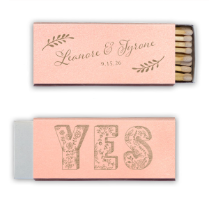 Ignite love’s spark with the Romantic YES Wedding Matchbox. Elegant leafy boughs frame the newlyweds' names in flourishing script on one side. Flip to an exuberant, floral-filled "YES" on the other—a timeless, botanical cheer for your happily ever after!