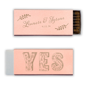 Ignite love’s spark with the Romantic YES Wedding Matchbox. Elegant leafy boughs frame the newlyweds' names in flourishing script on one side. Flip to an exuberant, floral-filled "YES" on the other—a timeless, botanical cheer for your happily ever after!