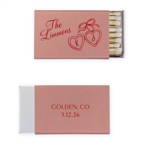 The Heart Locket Matchbox features elegant script lettering with customizable name, date, and location, and a charming ribboned locket illustration for a timeless keepsake feel. Choose it to add a sentimental detail guests will treasure. Great for weddings and anniversaries.