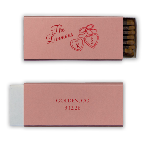 The Heart Locket Matchbox features elegant script lettering with customizable name, date, and location, and a charming ribboned locket illustration for a timeless keepsake feel. Choose it to add a sentimental detail guests will treasure. Great for weddings and anniversaries.