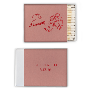 The Heart Locket Matchbox features elegant script lettering with customizable name, date, and location, and a charming ribboned locket illustration for a timeless keepsake feel. Choose it to add a sentimental detail guests will treasure. Great for weddings and anniversaries.