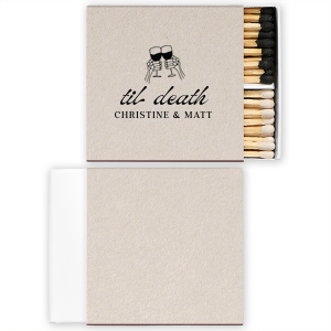 Find the perfect match with the Til Death Toast Match. Heat things up at your event with this striking accessory. Adorned with two skeletal hands clinking wine glasses above personalized text, they are perfect for seasonal weddings or Halloween events.