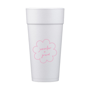 Sip in style at your whimsical wedding with the Kitschy Cocktail Hour Floral Frame Cup. Personalize this charming vessel with the couple's names, elegantly scripted within a blooming flower-shaped frame. A modern and enchanting choice for your celebratory toasts.