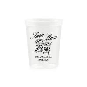 The Wedding Glass & Bow Cup is the must have trendy design for your one of a kind lifetime event. Featuring hand-drawn bows tied around champagne glasses alongside customizable text in the screen printed ink color of your choice to best pair with your party's vibe.