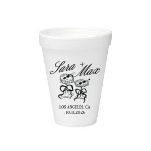 The Wedding Glass & Bow Cup is the must have trendy design for your one of a kind lifetime event. Featuring hand-drawn bows tied around champagne glasses alongside customizable text in the screen printed ink color of your choice to best pair with your party's vibe.