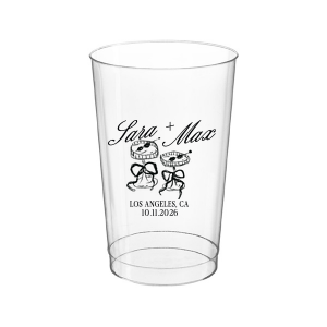 The Wedding Glass & Bow Cup is the must have trendy design for your one of a kind lifetime event. Featuring hand-drawn bows tied around champagne glasses alongside customizable text in the screen printed ink color of your choice to best pair with your party's vibe.