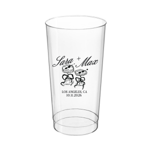 The Wedding Glass & Bow Cup is the must have trendy design for your one of a kind lifetime event. Featuring hand-drawn bows tied around champagne glasses alongside customizable text in the screen printed ink color of your choice to best pair with your party's vibe.