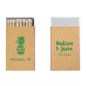 Spark some island charm with the Aloha Pineapple Matchbox, where 'Aloha' shines from a pineapple's heart, the classic emblem of hospitality. This matchbox ushers in a luxurious island welcome to your tropical nuptials.
