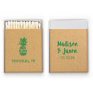 Spark some island charm with the Aloha Pineapple Matchbox, where 'Aloha' shines from a pineapple's heart, the classic emblem of hospitality. This matchbox ushers in a luxurious island welcome to your tropical nuptials.