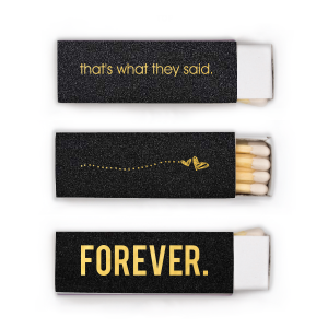 The That's What They Said Wedding Match is an engaging blend of contemporary vernacular and artistry. One panel displays the modern phrase “That’s what they said,” while another whimsically illustrates hearts soaring, leaving a trail of dots. The third side, with a bold "FOREVER," encapsulates eternal romance. This is a design that communicates boldly and artistically. 